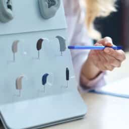 Audiologist showing hearing aid options